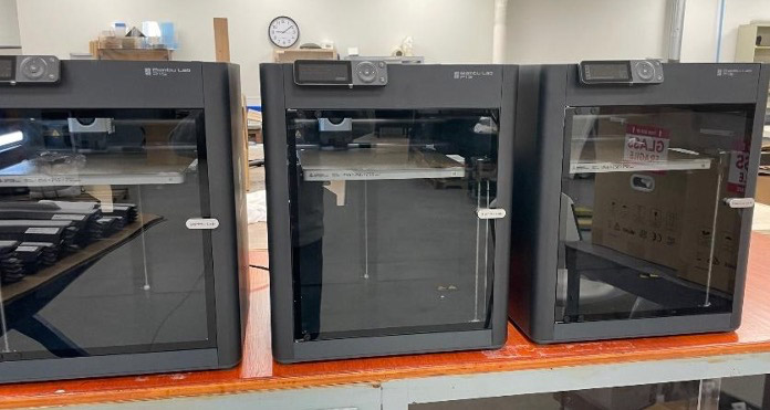 bank of three 3d printers